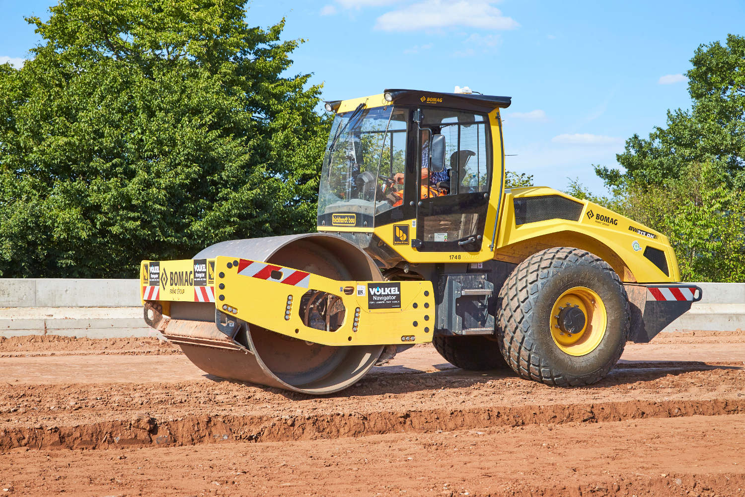 An earthmoving roller in action.